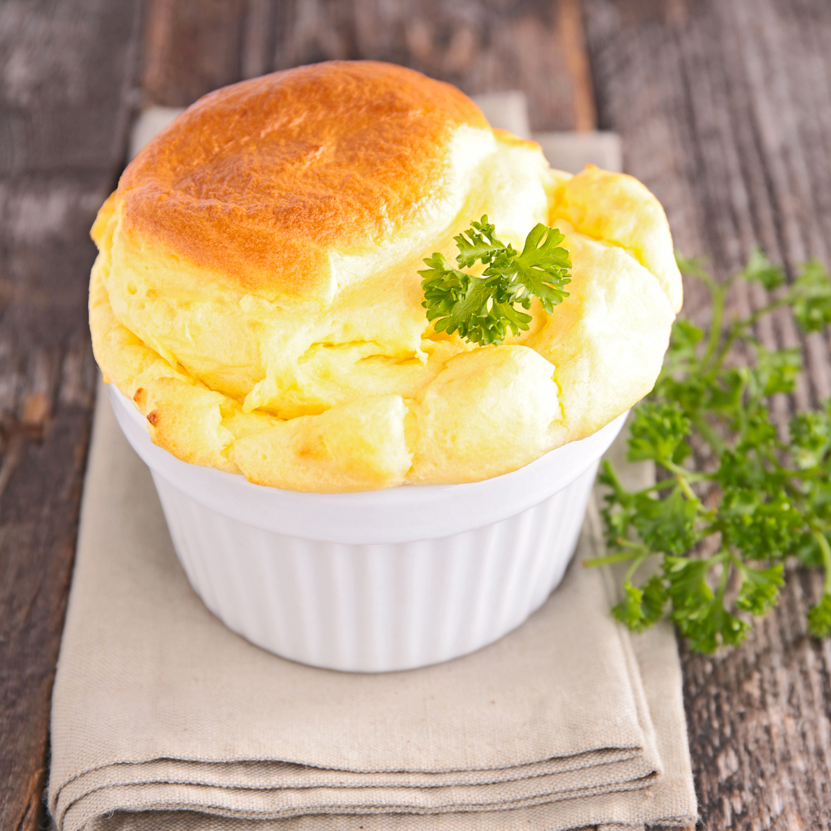 Sweet Corn Spoonbread on napkin on wooden table