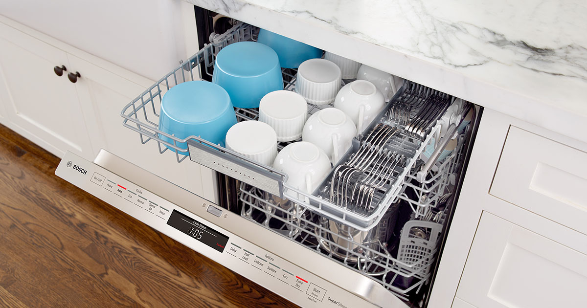 Open Bosch Benchmark dishwasher with loaded MyWay rack