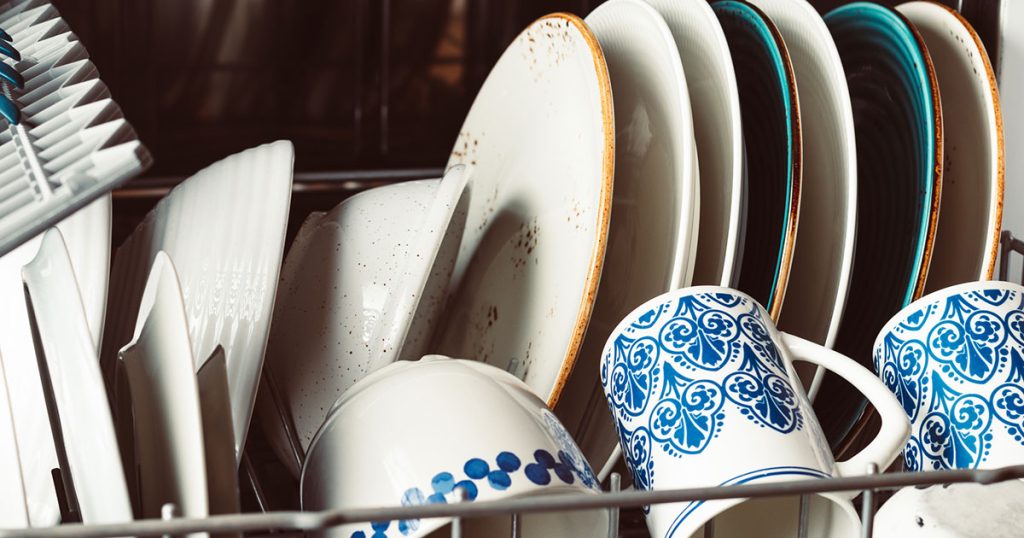 clean dishes in open dishwasher
